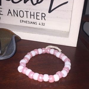 white and pink bracelet.